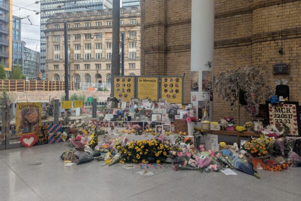 Tributes are laid for the 22 victims of the Manchester Arena bombing at Manchester Victoria Station, following a minute's silence on 22 May 2025. Credit: Alex Blair / Garden Court North Chambers.