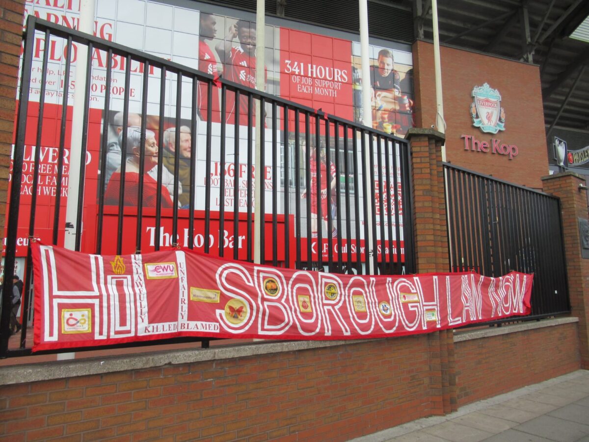 A Hillsborough Law Now banner outside The Kop, Anfield Stadium. Credit: Alex Blair / Garden Court North Chambers.